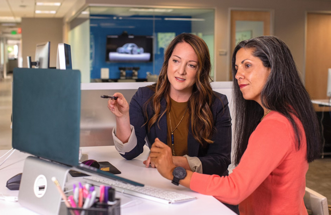 Two business women talking